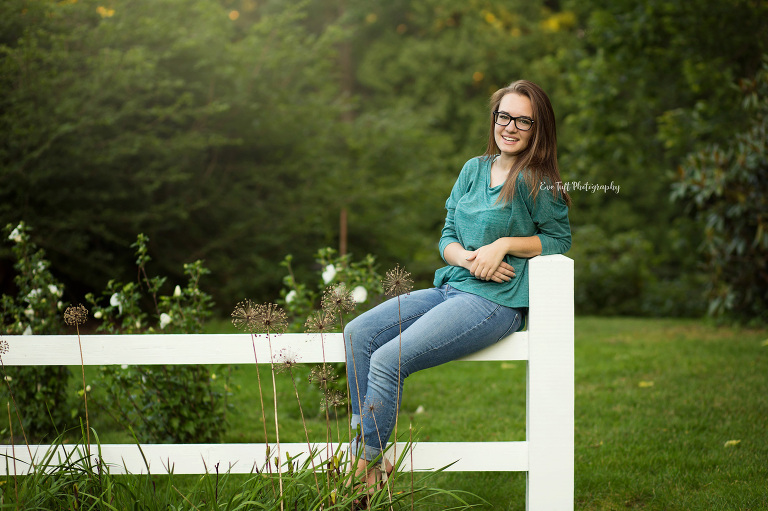 Senior girl sitting on a white fence. Midland, Michigan photographer