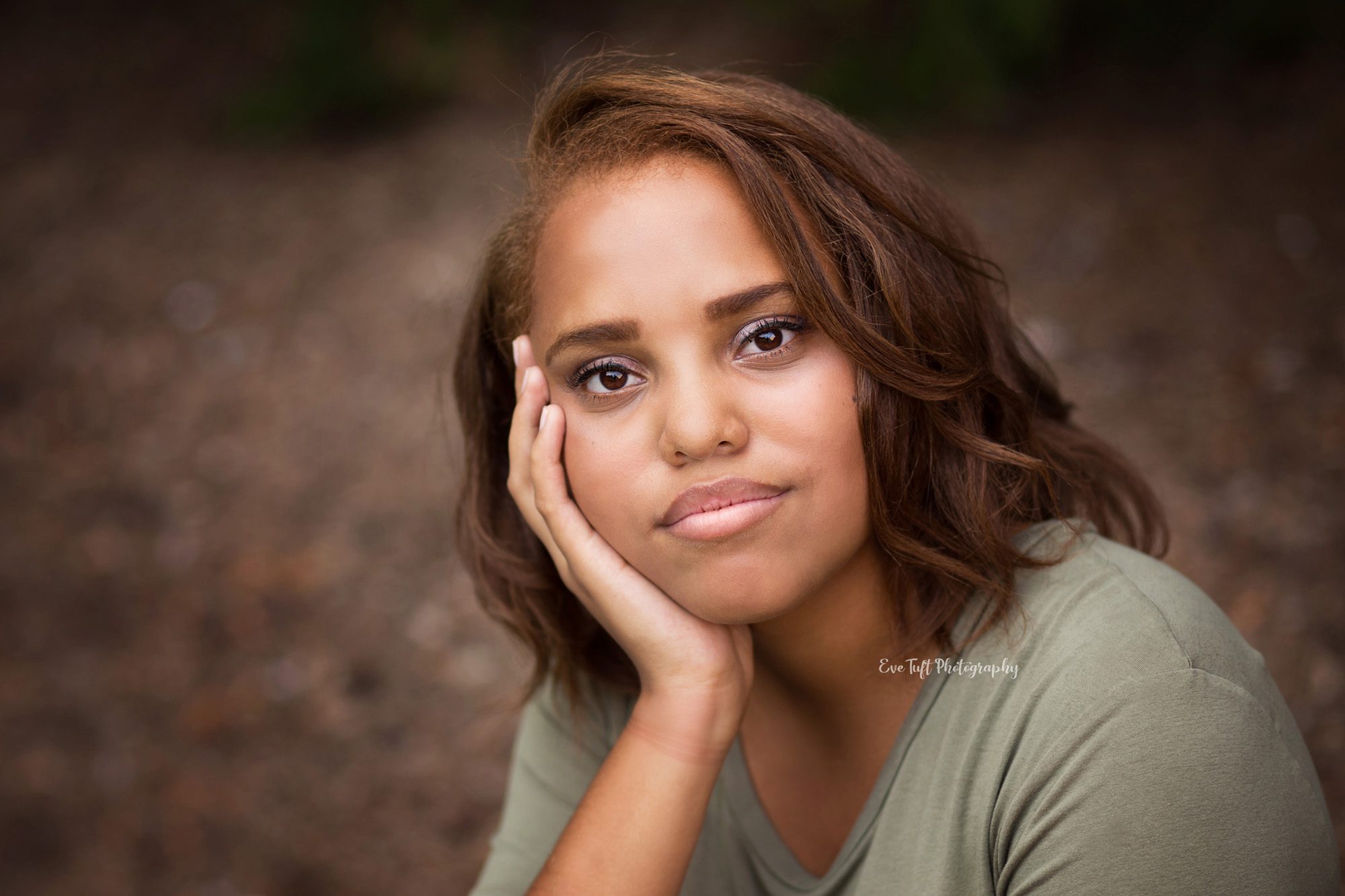 Beautiful senior girl with hand on side of face. Midland, Michigan photographer