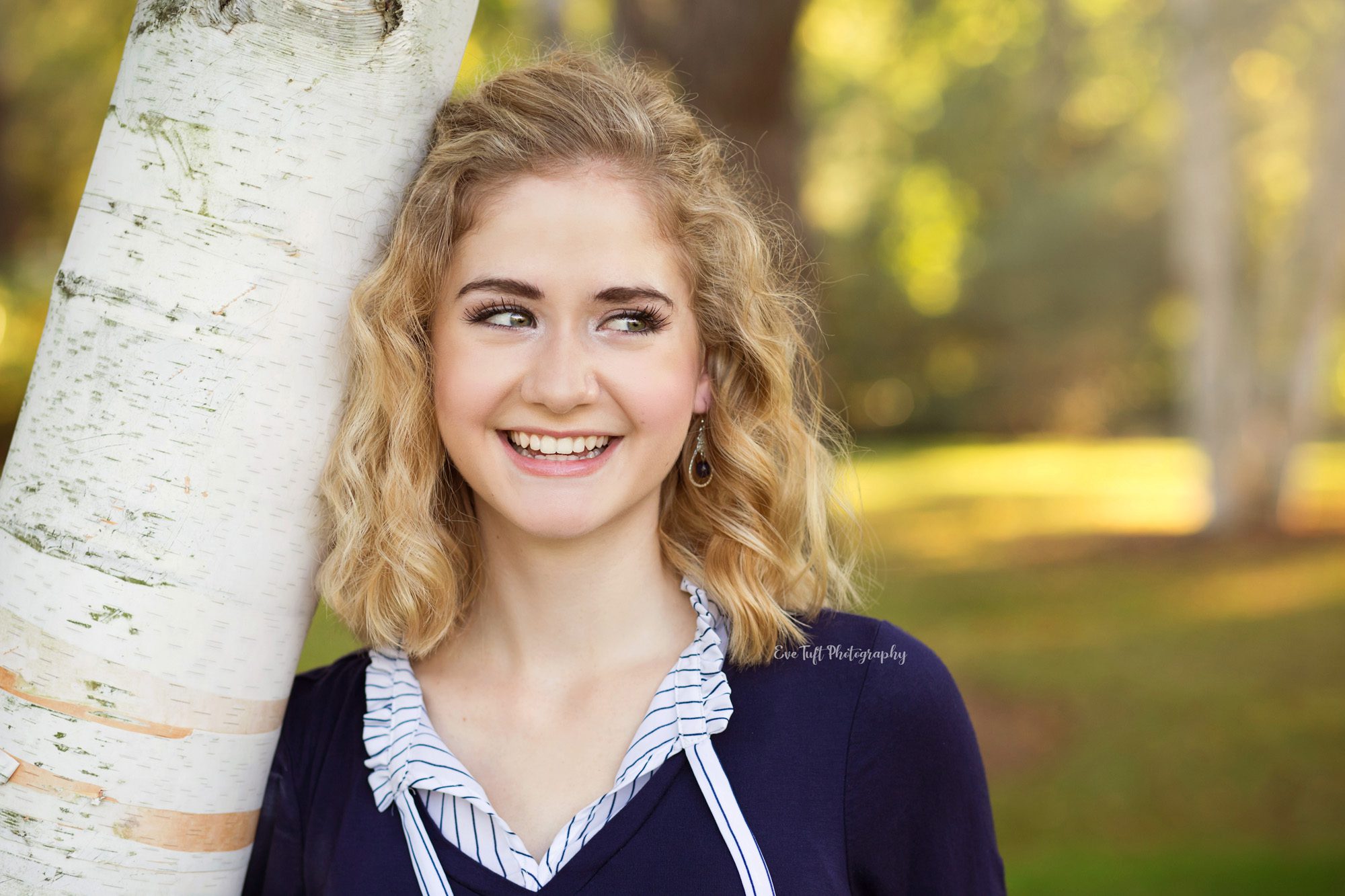 Laughing blond senior girl at Dow Gardens. Midland, Michigan photographer
