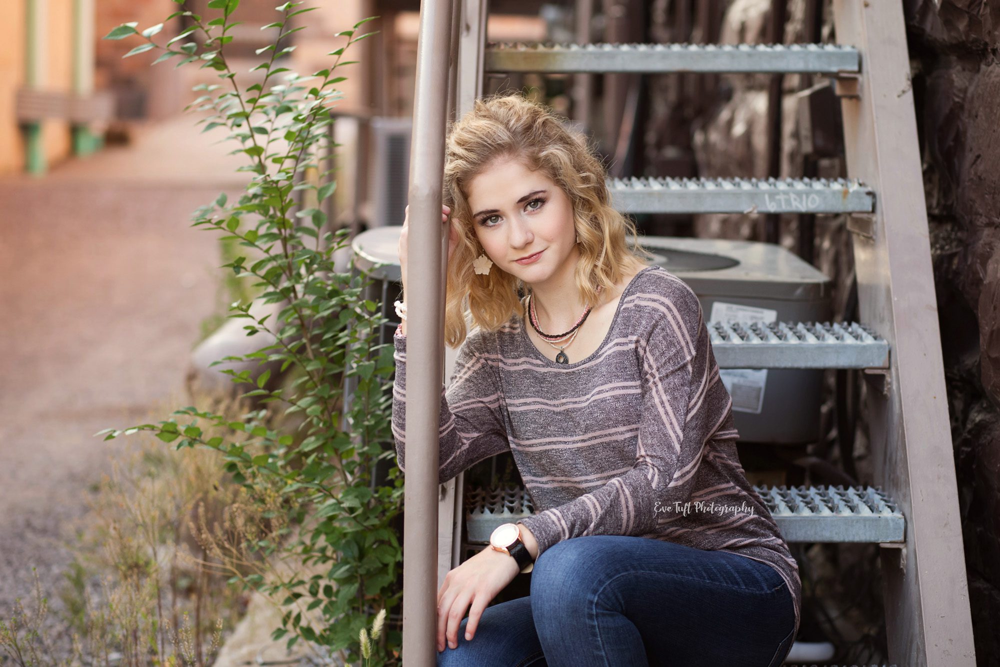 Senior girl in alley in downtown Midland, Michigan. Portrait photographer