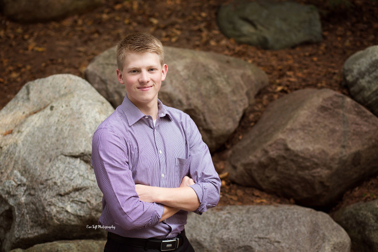 Senior boy with arms across his chest. Midland, Michigan photographer