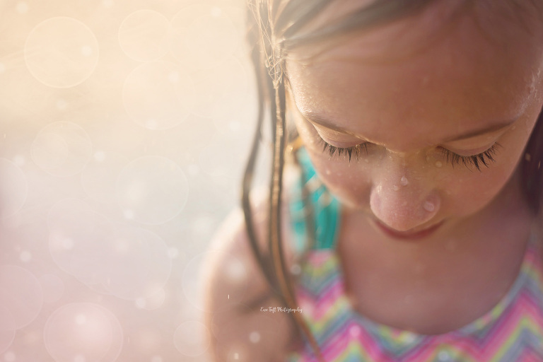 Girl with wet hair at a splash park. Midland, Michigan photographer