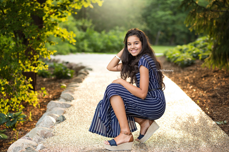 Senior girl crouching down on a sunny day | Midland Photographer in Michigan