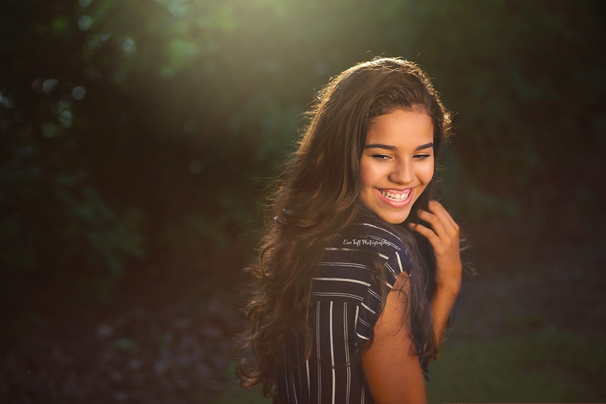Dark skinned girl with rim light around her hair. Saginaw, Michigan Photographer