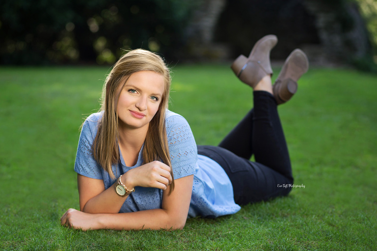 Dow High senior girl lying in the grass at Dow Gardens. Midland Photographer