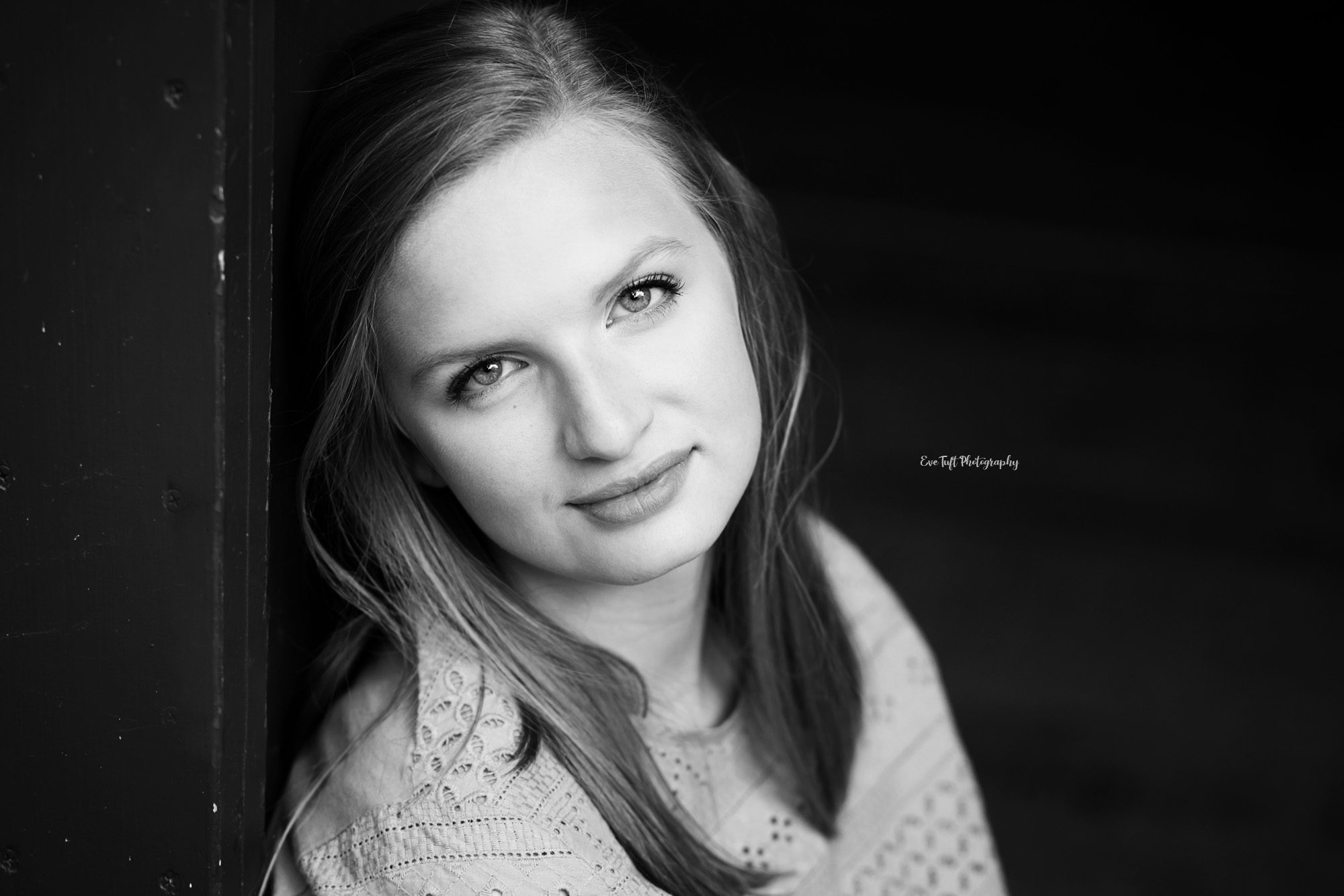 Black and white portrait of a senior girl softly smiling. Midland, Michigan portraits