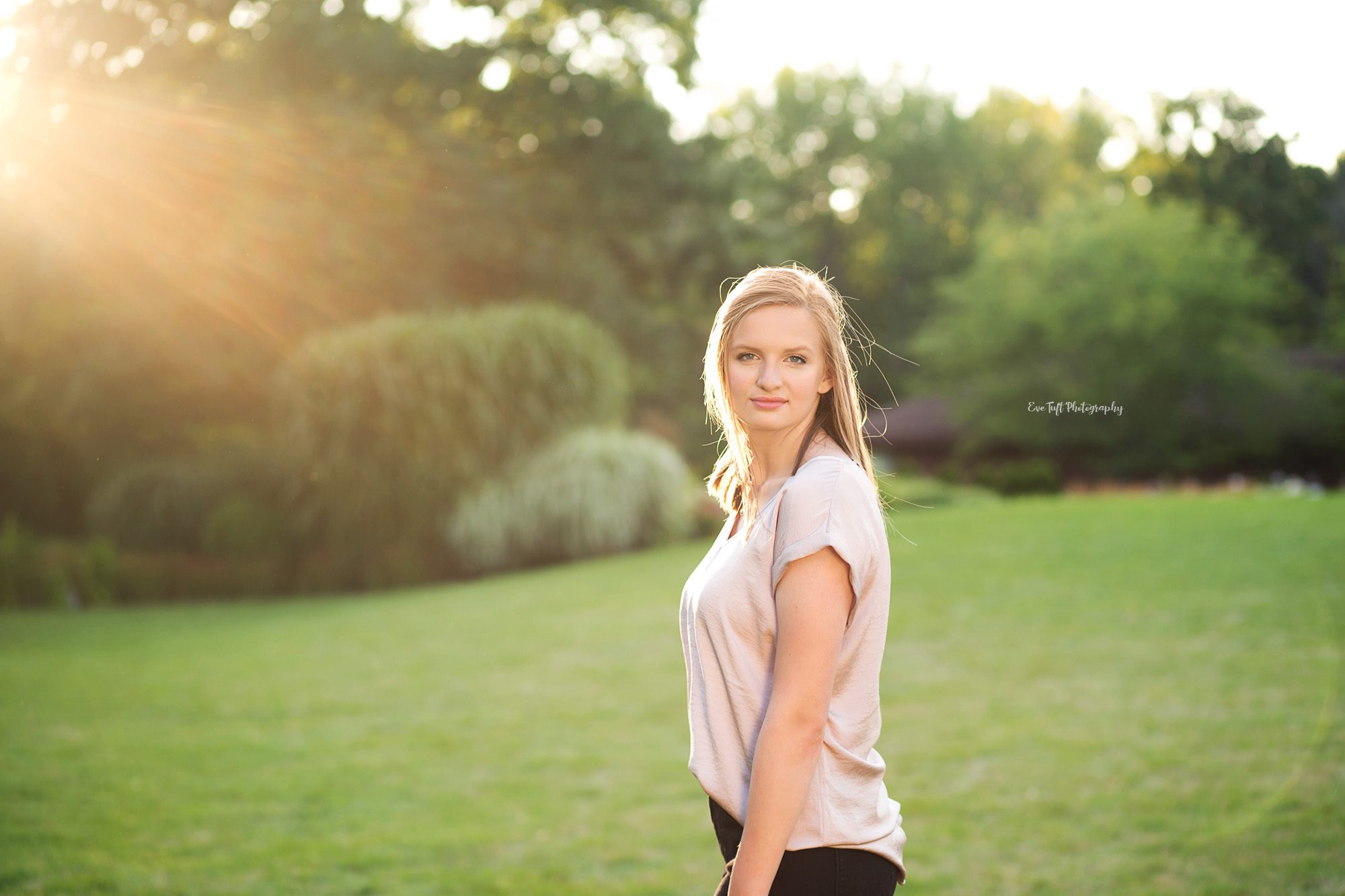 Gorgeous back-lit photo of a senior girl standing. Michigan photography
