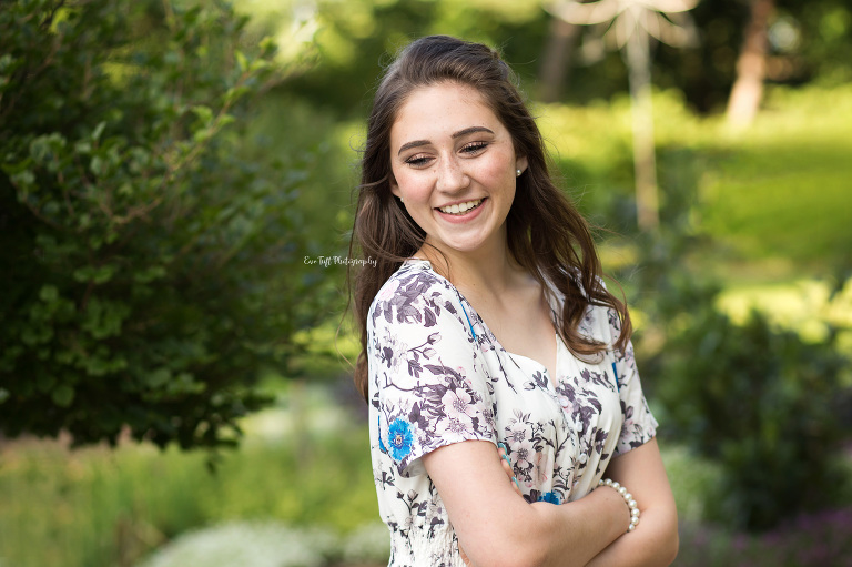 Senior girl standing and laughing in a garden | Michigan Portraits