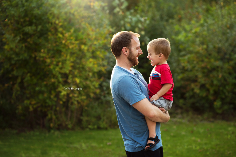 A father holding his son outside | Saginaw Michigan photographer