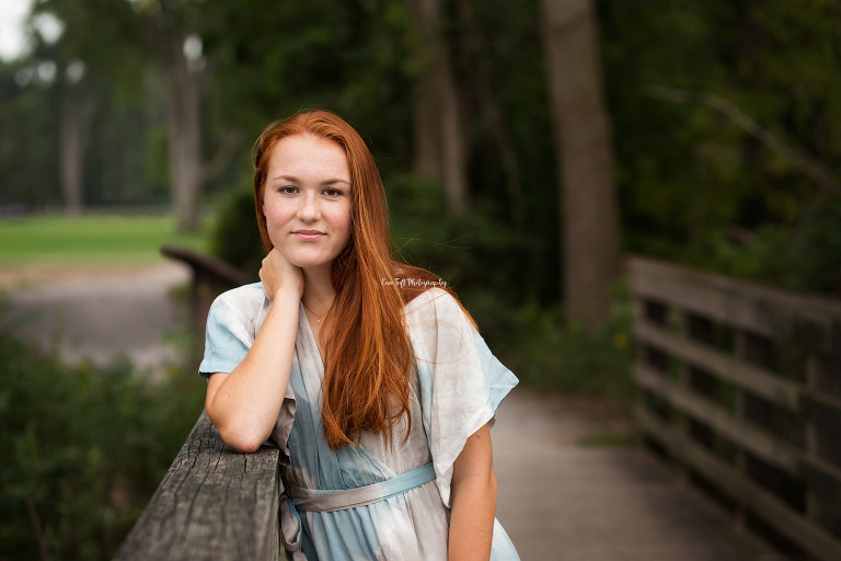 Red-Head senior girl wearing a 'Traveling' dress at Bay CIty, Michigan | High School Photographer
