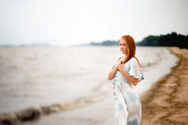 Teenage girl with long, red hair on the beach in Bay City, Michigan | Senior Portraits