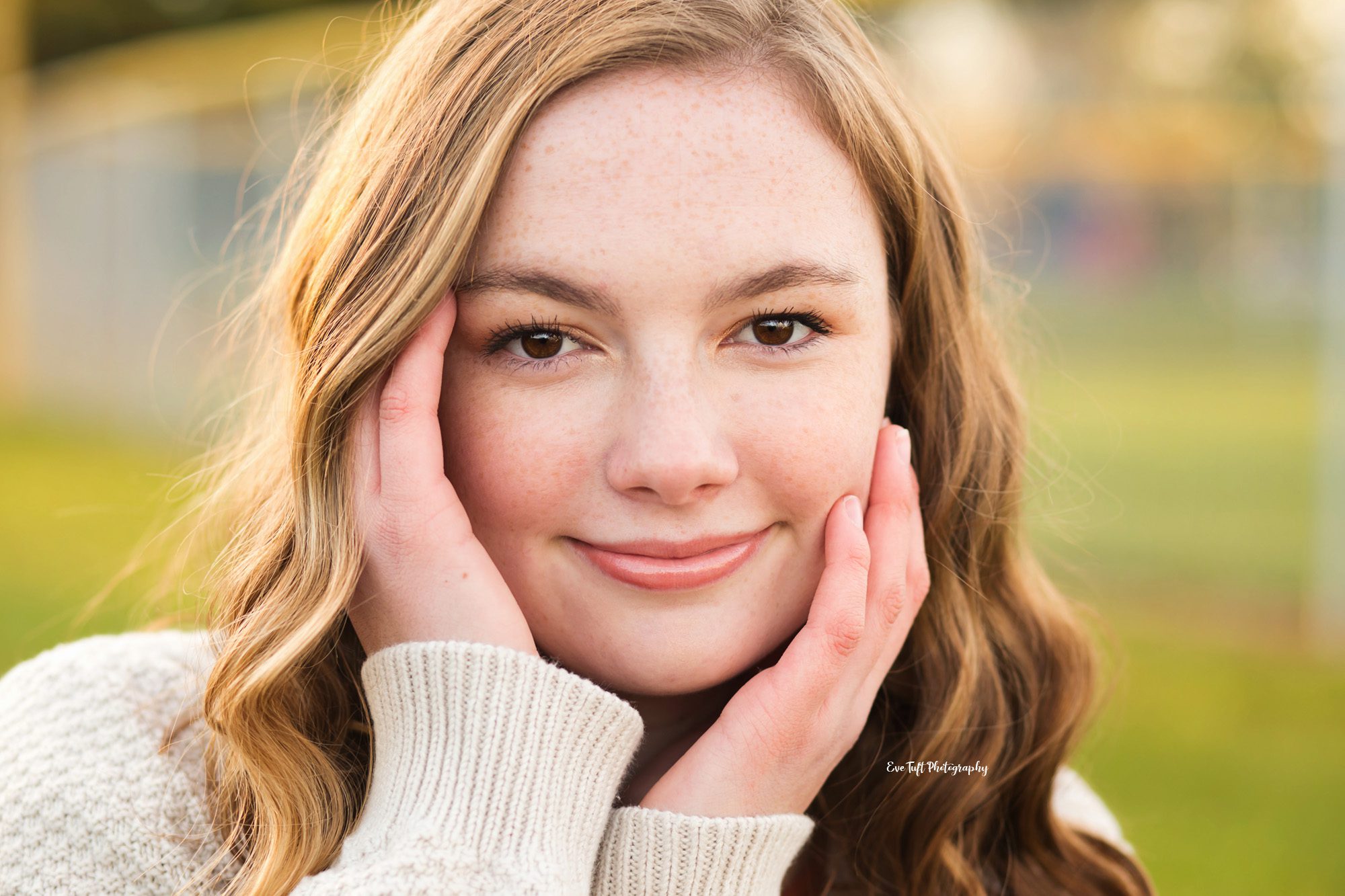 Teenager posing with her hands on her face | Photographer located in Midland, Michigan