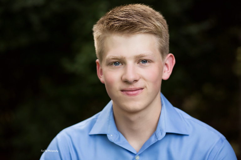 Senior boy who knows what to wear in a blue, button-up shirt | Midland Photographer