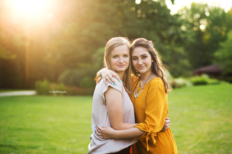 Two teenage girls hugging each other outside | Senior Photographer in Michigan