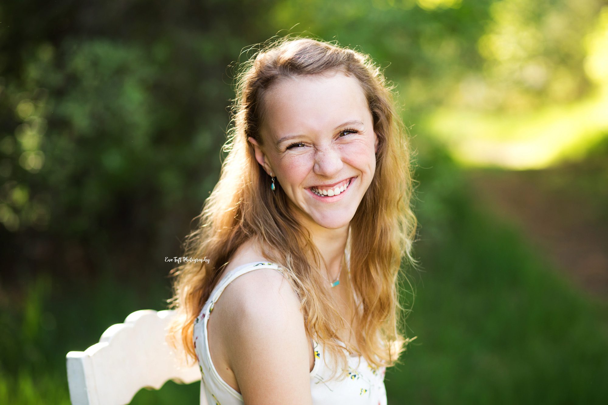 Up close of a senior girl laughing at the camera