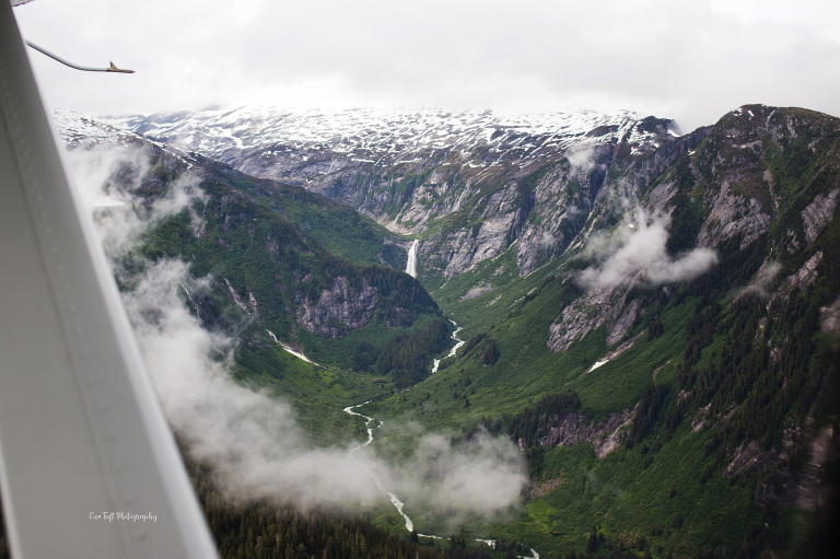 Mountains and waterfalls in Alaska seen from a plance