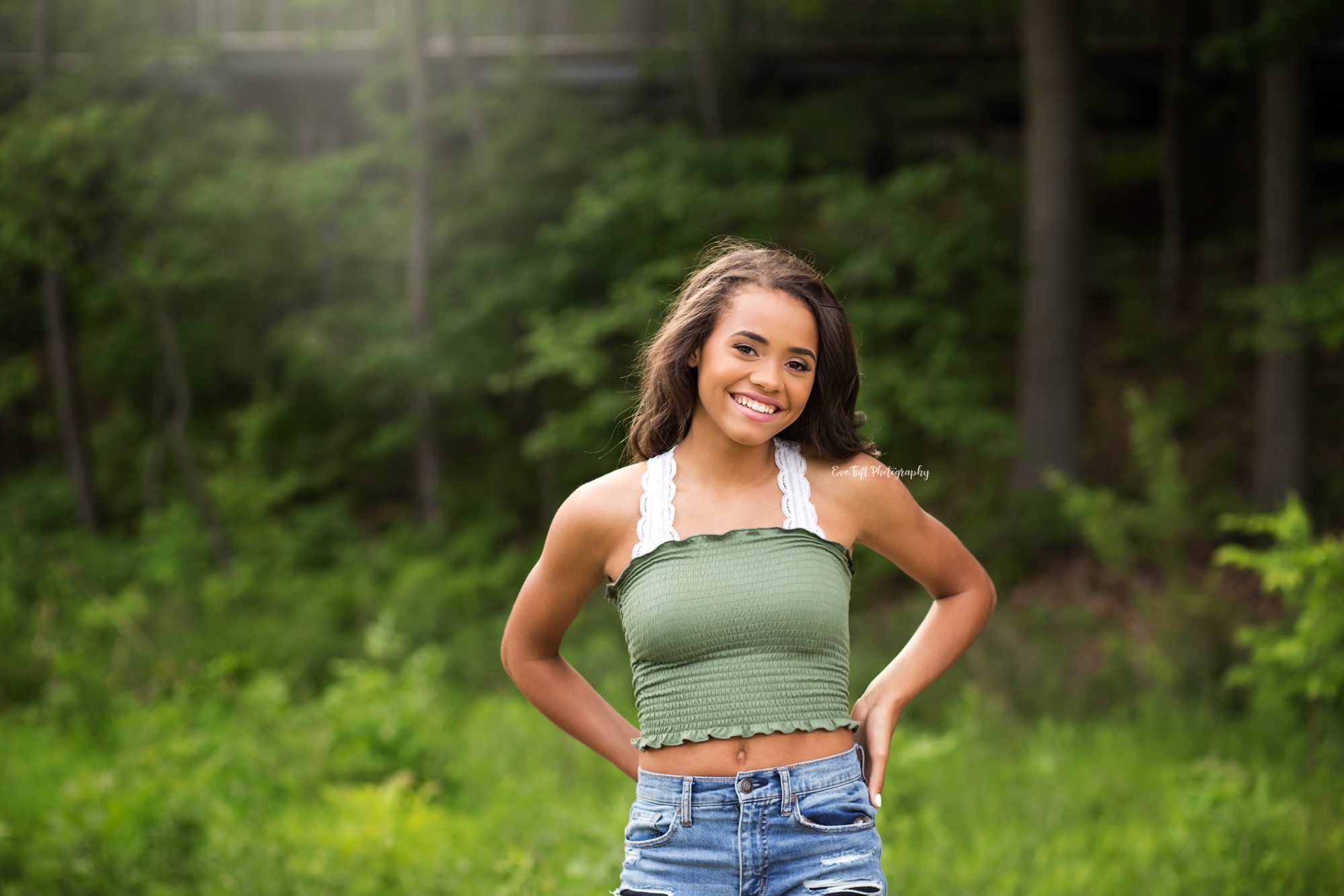 Senior girl posing outside with her hands in her back pockets | Senior Portraits in Michigan
