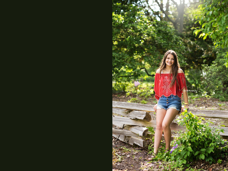 A senior named Chloe leans against a wooden fence outside for her photo session | Midland Senior Photographer Eve Tuft