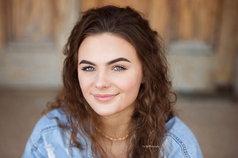 Close up of a high school girl for her senior photo session with Eve Tuft Photography | Michigan High School Photographer