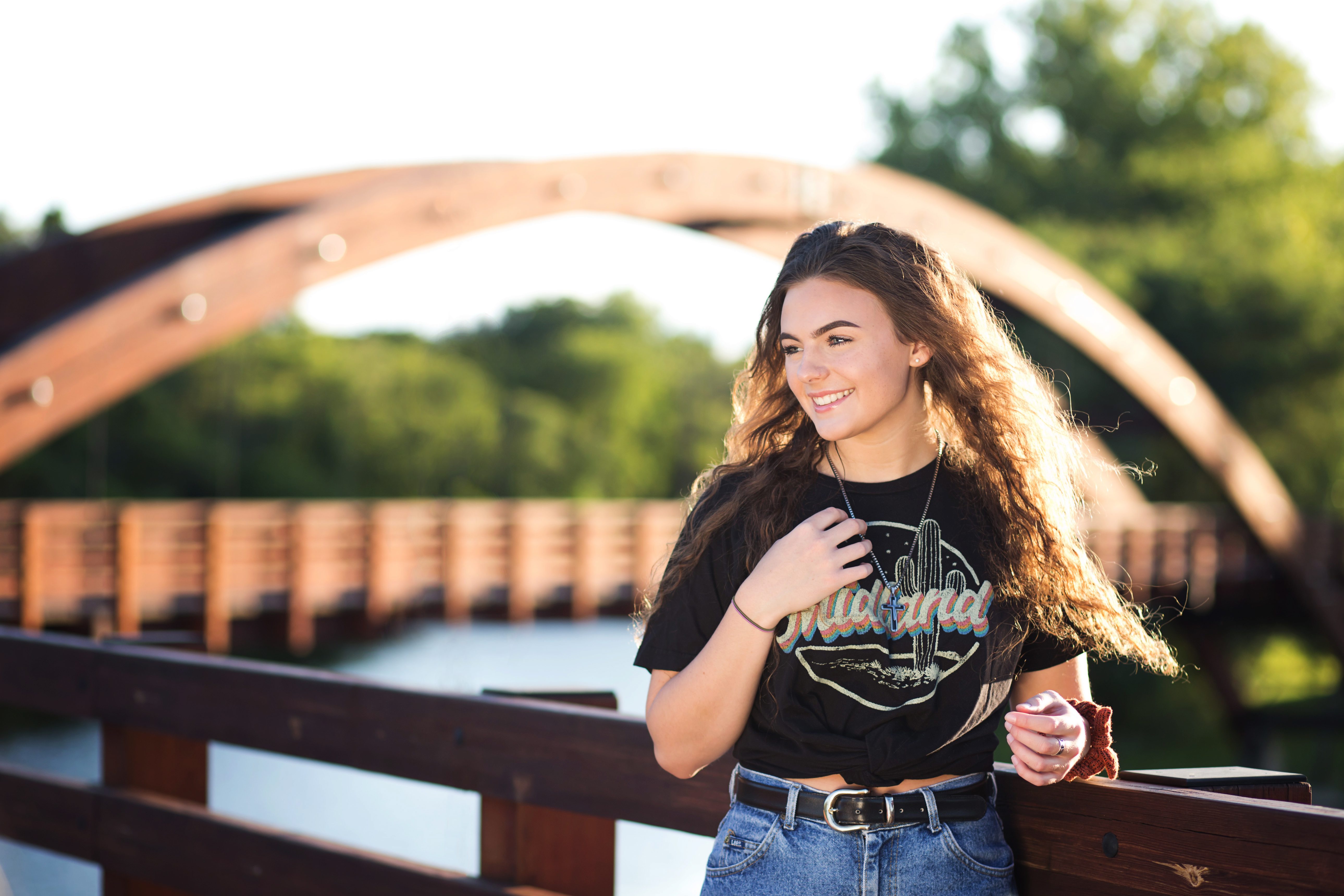A high School girl standing on the Tridge | Senior Session in Midland, Michigan | Senior Photographer