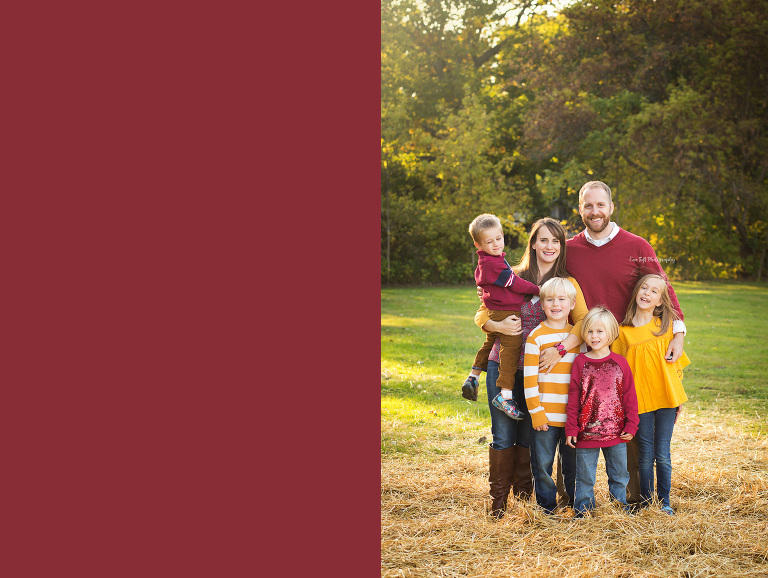 A family of six group together for their family pictures outside | Portrait Photographer in Midland