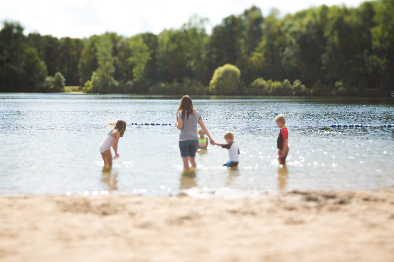 Get to know me, Eve Tuft, through pictures of me and my kids at Sanford Lake in the summer in Michigan