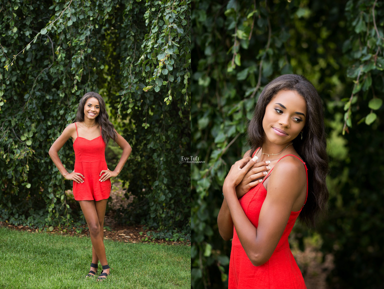 A senior girl stands in front of a willow-like tree at Dow Gardens | Michigan Premier Senior Photographer