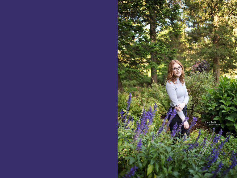 A senior stands in front of flowers after the rain in Dow Gardens | Midland, MI senior photographers