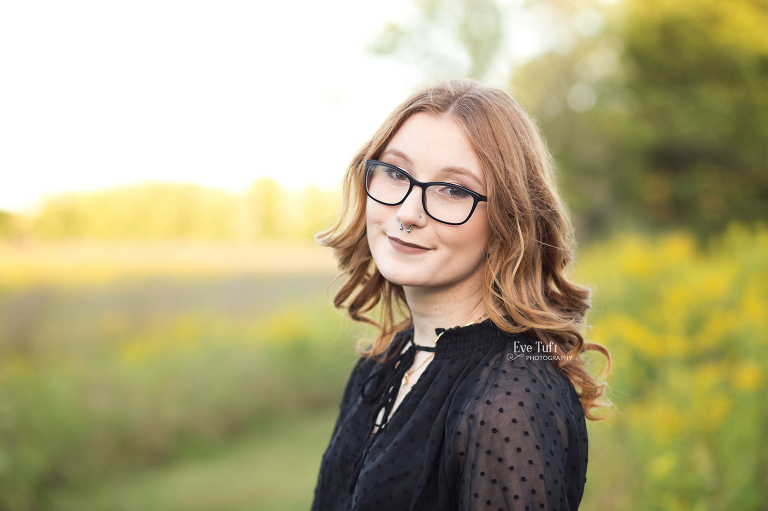 Headshot of a beautiful senior girl in a field outside at the Chippewa Nature center | Senior Photographer in Midland, MI