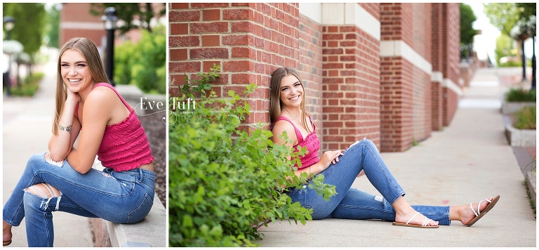 Beautiful teenager from Saginaw sits by a brick wall in downtown Midland | Senior Photographers in Michigan