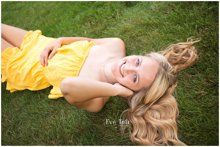 Beautiful senior lies down in the grass | Michigan's top senior photographers