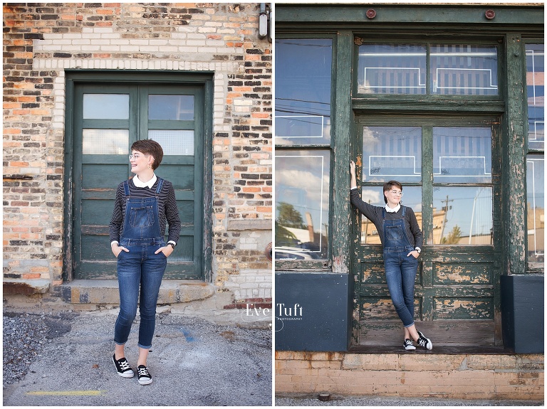 A senior leans against a doorframe in an alleyway | Bay City Senior Photographer