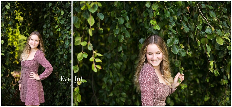 A high school teen stands next to a willow tree at Dow Gardens | Senior Photographer in Midland, Michigan