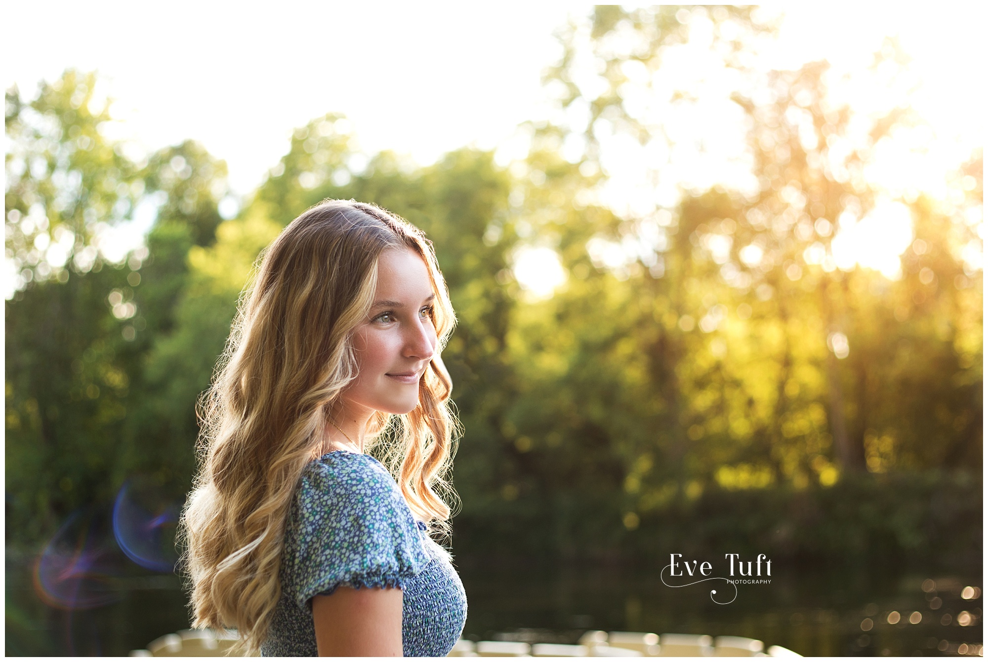 A beautiful teenager looks out over the water | Senior Photographers in Midland, MI