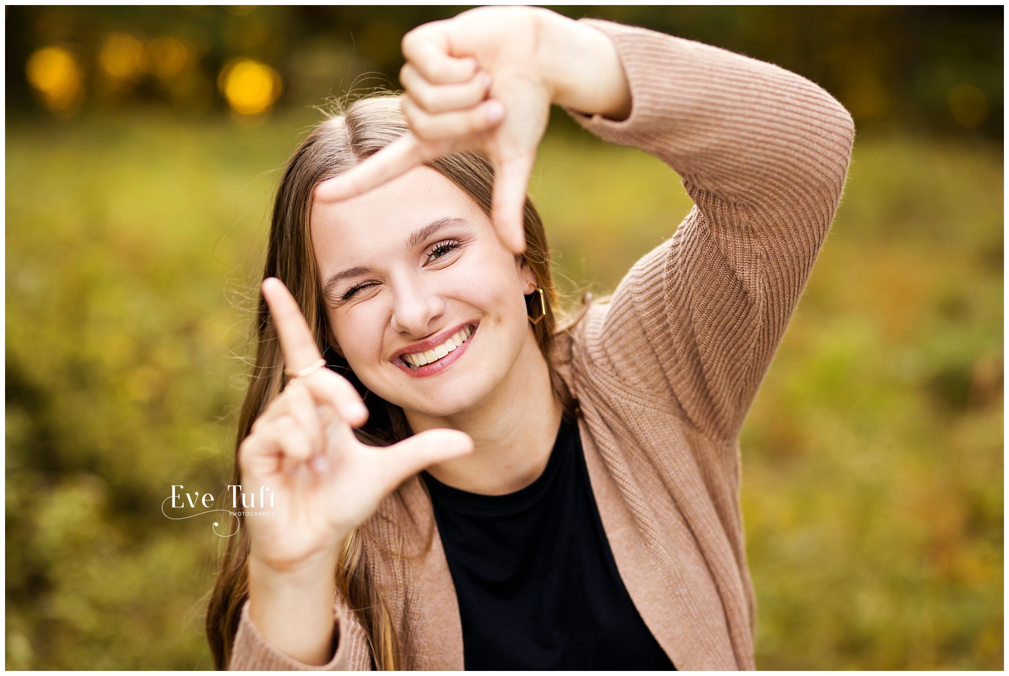A teen poses outside for her session | Eve Tuft Photographer in Michigan