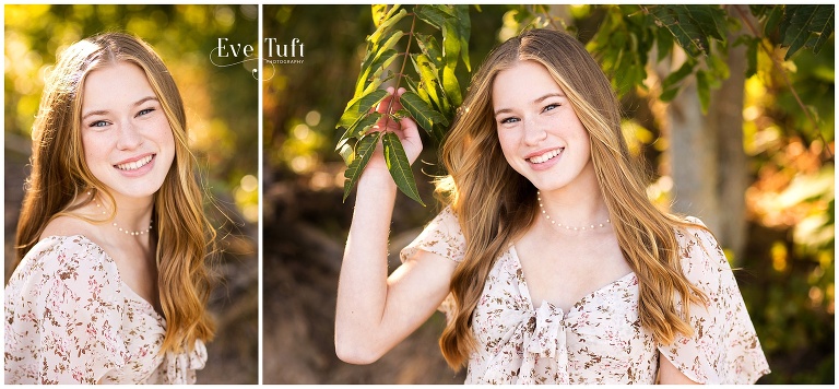 A woman poses next to a tree on the beach for her beachy session | Bay City State Park Senior Session in Michigan