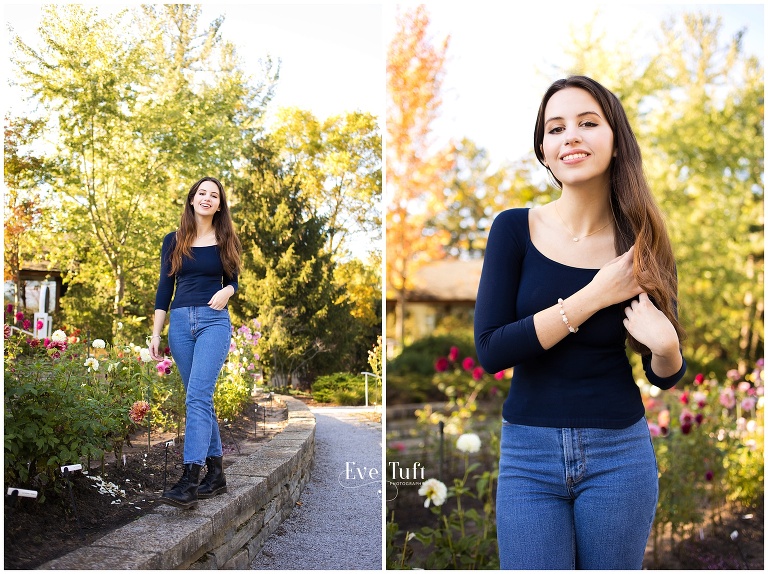 A teen walks along a pathway at Dahlia Hill for her session outdoors | Senior Photographer in Midland, MI